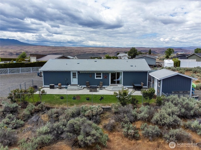 101 Lake Pl SW Unit 328, Mattawa, WA 99349 - back of house featuring entry steps, a fenced backyard, a patio, and a mountain view