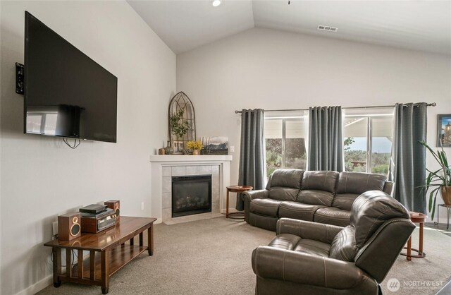11975 NE Neppel Rd, Moses Lake, WA 98837 - living area featuring carpet, a tile fireplace, and high vaulted ceiling