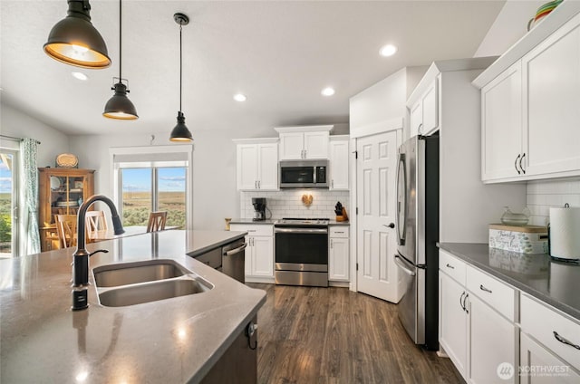 11975 NE Neppel Rd, Moses Lake, WA 98837 - kitchen with stainless steel appliances, a sink, healthy amount of natural light, tasteful backsplash, and recessed lighting