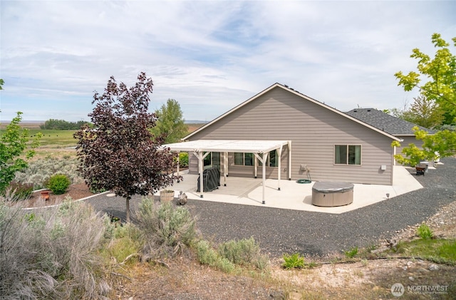 11975 NE Neppel Rd, Moses Lake, WA 98837 - back of house with a patio and a hot tub
