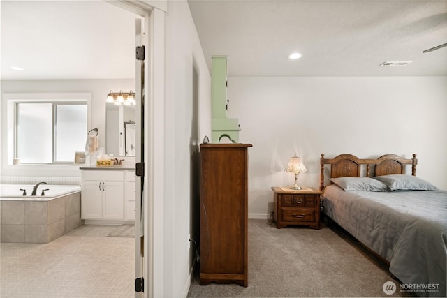 11975 NE Neppel Rd, Moses Lake, WA 98837 - bedroom featuring light carpet, a sink, ensuite bathroom, and recessed lighting