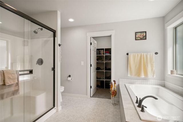 11975 NE Neppel Rd, Moses Lake, WA 98837 - full bath with a shower stall, a walk in closet, a bath, recessed lighting, and toilet