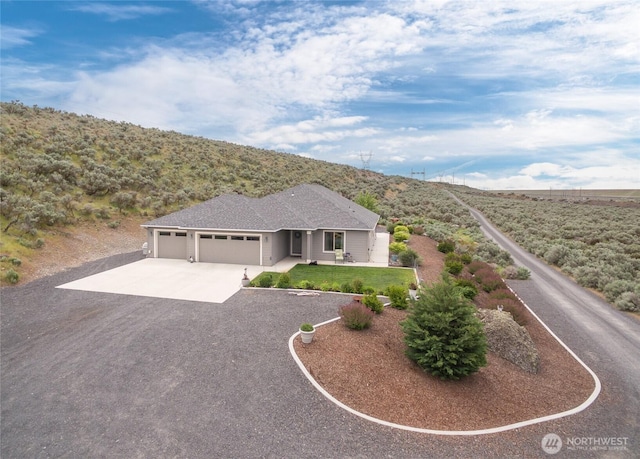 11975 NE Neppel Rd, Moses Lake, WA 98837 - ranch-style house featuring a garage and driveway