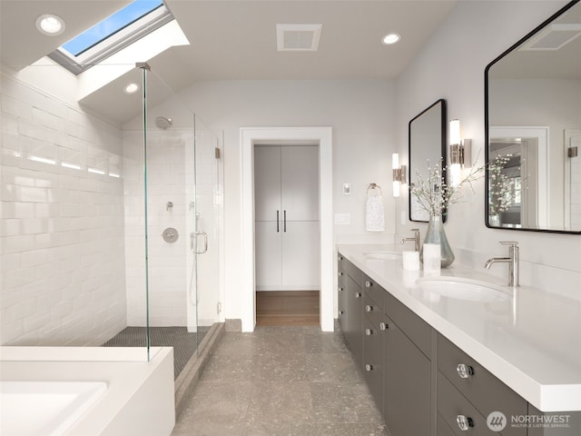 full bath with a skylight, a stall shower, double vanity, recessed lighting, and vaulted ceiling