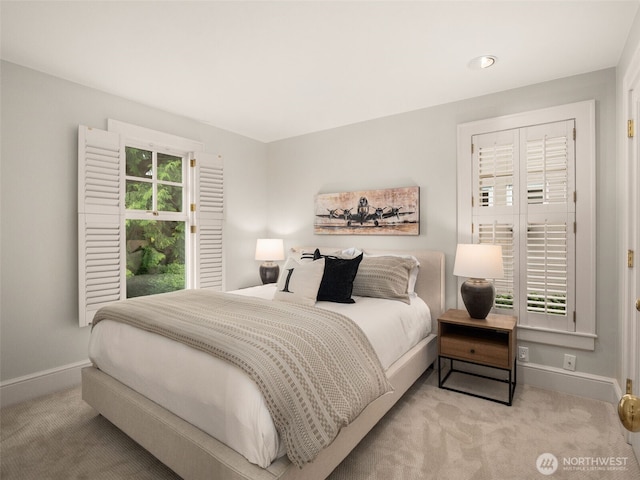 carpeted bedroom with baseboards