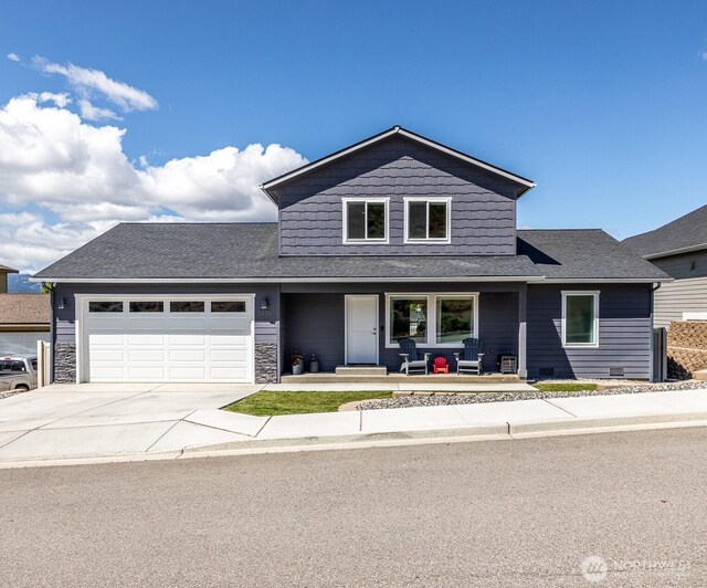 2436 Berkley Loop, East Wenatchee, WA 98802 - view of front of house with a garage, concrete driveway, covered porch, and a shingled roof