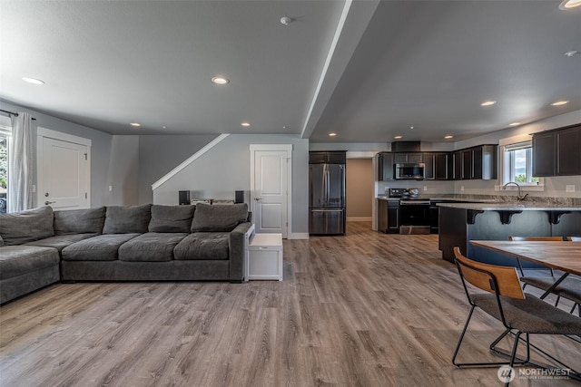 2436 Berkley Loop, East Wenatchee, WA 98802 - living area featuring wood finished floors and recessed lighting