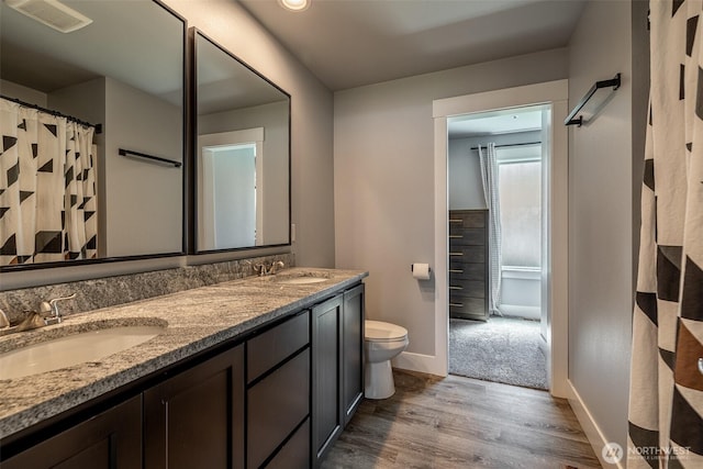 2436 Berkley Loop, East Wenatchee, WA 98802 - full bath with wood finished floors, baseboards, toilet, and double vanity