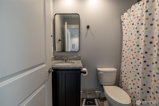 2436 Berkley Loop, East Wenatchee, WA 98802 - bathroom with toilet, vanity, and curtained shower