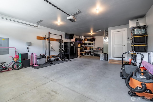 2436 Berkley Loop, East Wenatchee, WA 98802 - garage featuring electric panel and a garage door opener