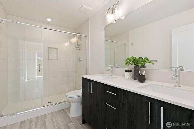 109 22nd Ave E Unit C, Seattle, WA 98112 - full bathroom featuring toilet, a shower stall, and double vanity