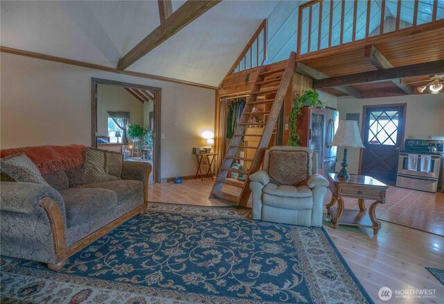 285 Pete Beck Rd, Quilcene, WA 98376 - living room featuring wood finished floors, beam ceiling, and high vaulted ceiling