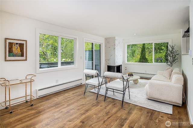 6533 106th Ave NE Unit D, Kirkland, WA 98033 - living area featuring a baseboard radiator and wood finished floors