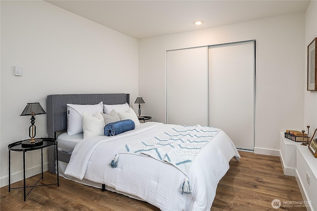 6533 106th Ave NE Unit D, Kirkland, WA 98033 - bedroom with a closet, wood finished floors, recessed lighting, and baseboards