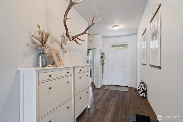817 B St, Vader, WA 98593 - entrance foyer with dark wood-type flooring and baseboards
