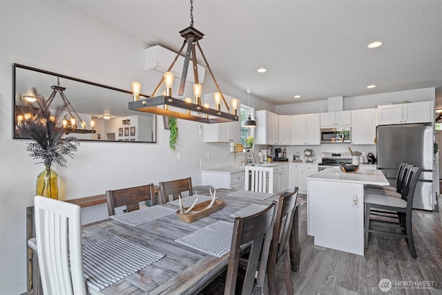 817 B St, Vader, WA 98593 - dining room featuring a chandelier, dark wood-style floors, and recessed lighting