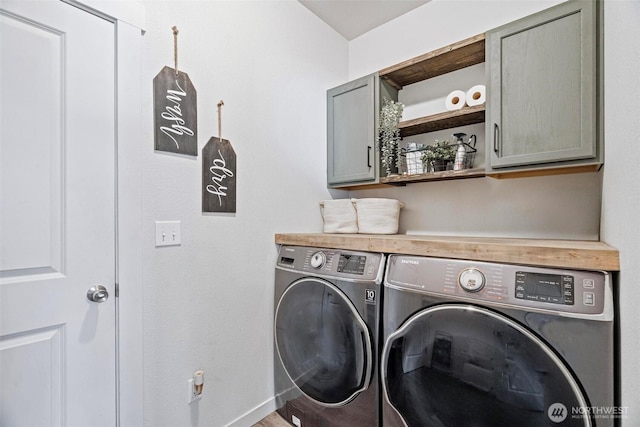 817 B St, Vader, WA 98593 - laundry area featuring cabinet space and independent washer and dryer