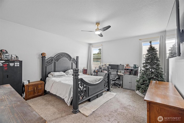 817 B St, Vader, WA 98593 - bedroom with light colored carpet, a desk, a ceiling fan, and a textured ceiling