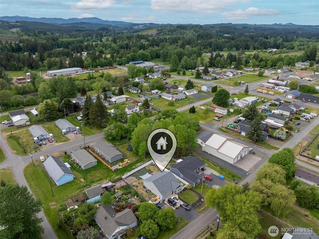 817 B St, Vader, WA 98593 - aerial perspective of suburban area featuring a forest and a mountainous background