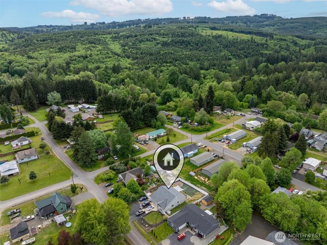 817 B St, Vader, WA 98593 - aerial view of property and surrounding area featuring a heavily wooded area and nearby suburban area