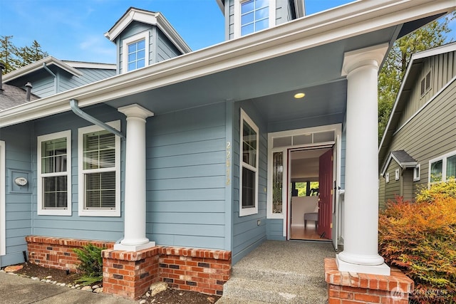 view of exterior entry with covered porch