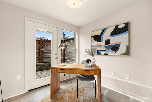 office with baseboards and wood finished floors