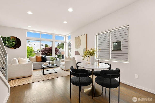 dining area with wood finished floors, recessed lighting, and baseboards