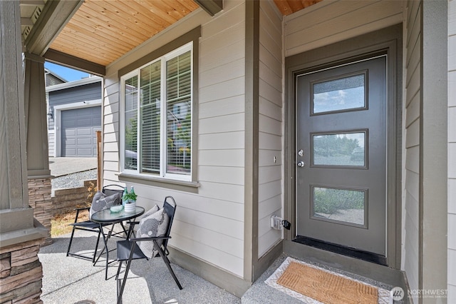 entrance to property featuring covered porch