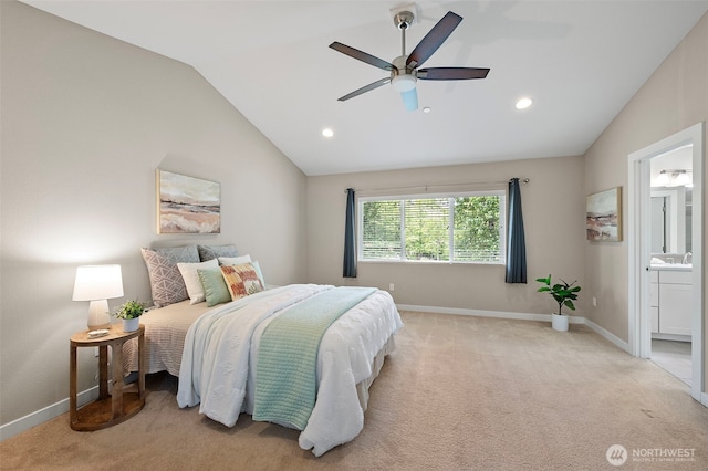 carpeted bedroom featuring vaulted ceiling, recessed lighting, baseboards, ensuite bath, and ceiling fan
