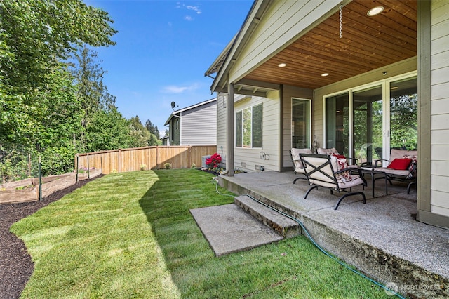 view of yard featuring a patio area and a garden