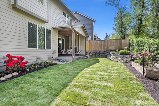 view of yard with a patio area and a garden