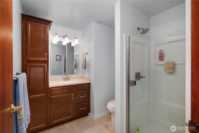 130 E Agate Dr, Shelton, WA 98584 - full bathroom with a shower stall, vanity, toilet, and baseboards