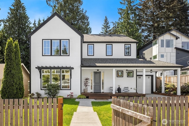3815 NE 89th St, Seattle, WA 98115 - view of front of home with covered porch, a garage, and roof with shingles