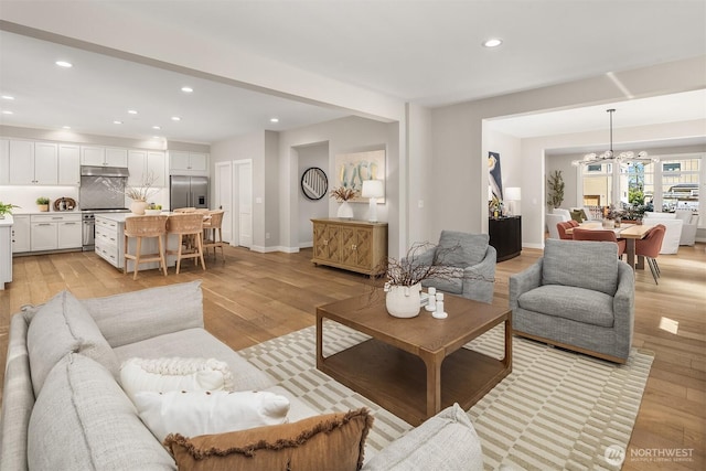 3815 NE 89th St, Seattle, WA 98115 - living room with recessed lighting, light wood-style floors, a chandelier, and baseboards