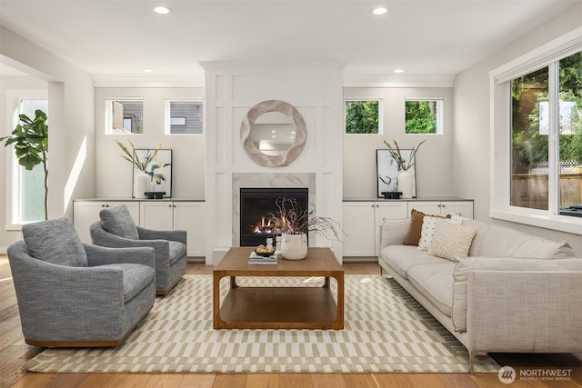 3815 NE 89th St, Seattle, WA 98115 - living room with wood finished floors, a premium fireplace, recessed lighting, and crown molding