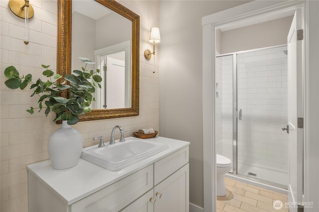 3815 NE 89th St, Seattle, WA 98115 - full bathroom featuring a shower stall, tile walls, toilet, vanity, and tile patterned floors