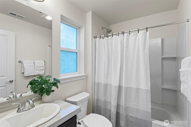 full bathroom with vanity, toilet, and shower / bath combo with shower curtain