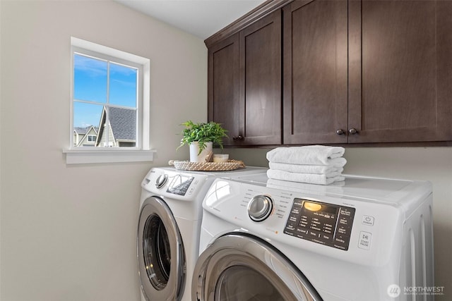 laundry room with cabinet space and independent washer and dryer
