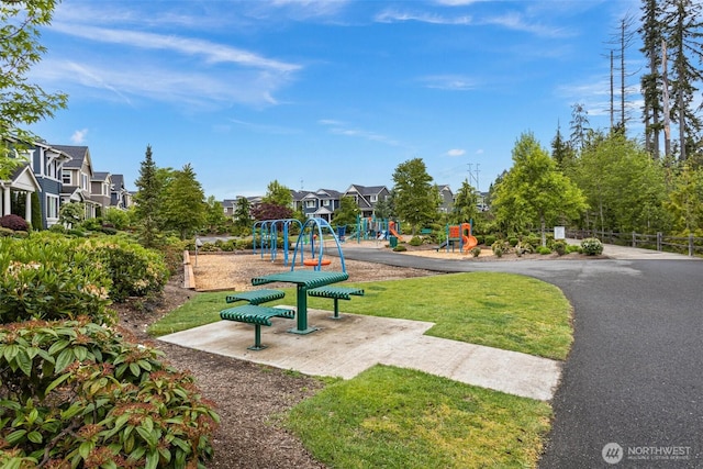 view of home's community with a residential view and a yard