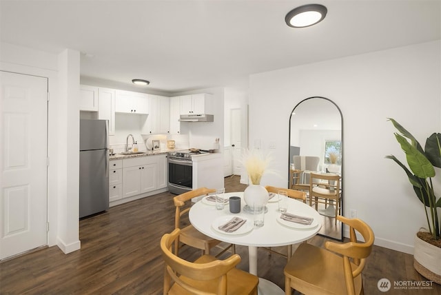 3834 175th Ave NE Unit E49, Redmond, WA 98052 - dining room featuring dark wood-style flooring and baseboards