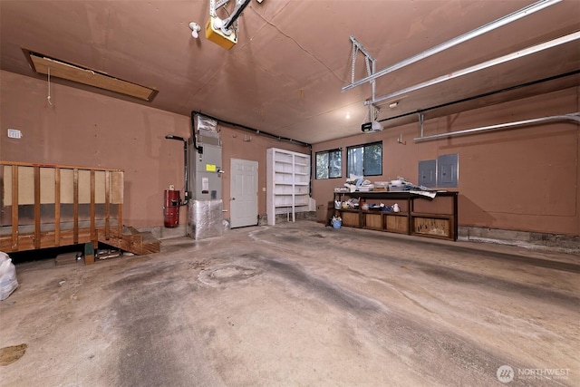 2526 E Pershing Ct, Shelton, WA 98584 - garage featuring a garage door opener, electric panel, and heating unit