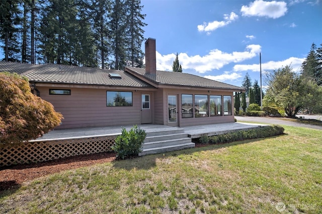 2526 E Pershing Ct, Shelton, WA 98584 - rear view of property with a chimney, a lawn, a deck, and a tile roof