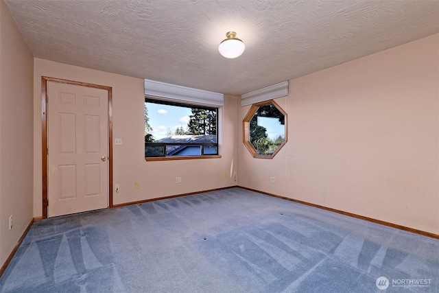 2526 E Pershing Ct, Shelton, WA 98584 - carpeted spare room featuring baseboards and a textured ceiling