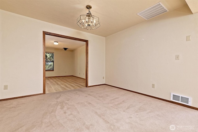 2526 E Pershing Ct, Shelton, WA 98584 - unfurnished room featuring a chandelier, carpet flooring, and baseboards