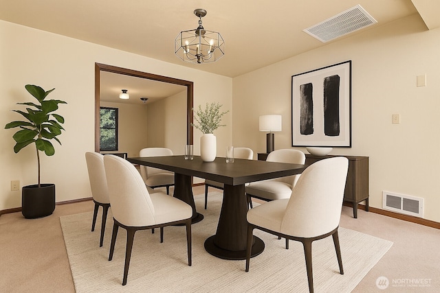 2526 E Pershing Ct, Shelton, WA 98584 - dining area featuring light colored carpet, baseboards, and a chandelier