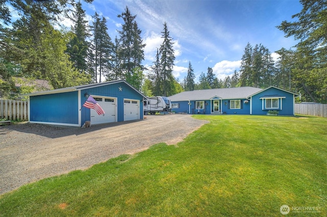 view of front of property with a garage and an outdoor structure