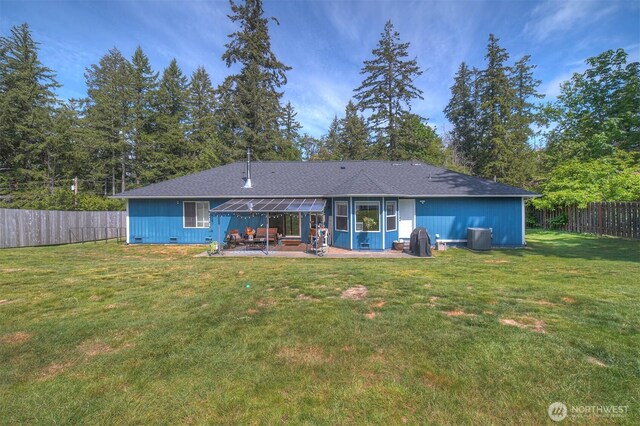 rear view of house with a patio area and central air condition unit