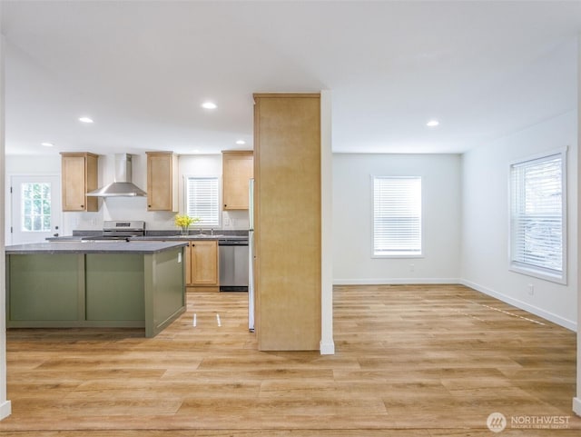 353 Mount Olympus Ave SE, Ocean Shores, WA 98569 - kitchen featuring wall chimney range hood, appliances with stainless steel finishes, light wood finished floors, recessed lighting, and baseboards
