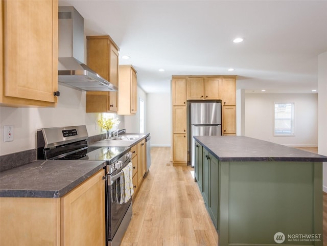 353 Mount Olympus Ave SE, Ocean Shores, WA 98569 - kitchen with wall chimney range hood, stainless steel appliances, dark countertops, a sink, and light wood-style floors