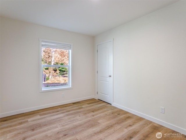 353 Mount Olympus Ave SE, Ocean Shores, WA 98569 - unfurnished room with light wood-style flooring and baseboards